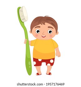 Cute boy  holding a toothbrush Vector illustration in cartoon style.
