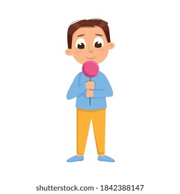 Cute Boy Licking Candy on Stick, Kid Enjoying of Eating Lollipop Dessert Cartoon Style Vector Illustration