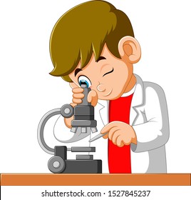 Cute boy looking through a microscope