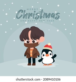 Cute boy with mask and penguin celebrating christmas
