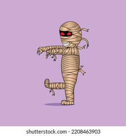cute boy in mummy halloween costume with red eyes