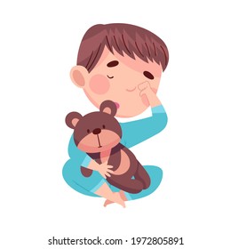 Cute Boy in Pajamas Sitting with Teddy Bear Rubbing His Eyes with Fist Feeling Sleepy Vector Illustration