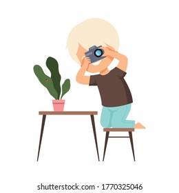 Cute Boy Photographer Holds Camera in his Hands and Taking Photo of Houseplant, Kids Hobby or Creative Activity Cartoon Vector Illustration