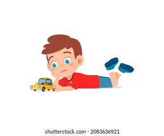 cute boy play toy car alone and feel sad