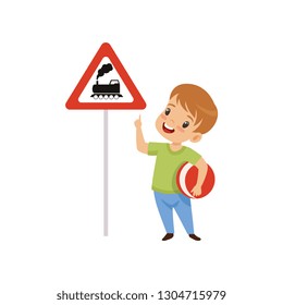 Cute Boy Pointing Finger at Triangle Road Sign wiith Train, Traffic Education, Rules, Safety of Kids in Traffic Vector Illustration