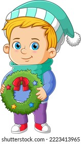 Der süße Junge bereitet sich darauf vor, den Weihnachtskranz an die Tür der Illustration zu setzen