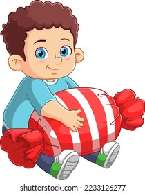 Cute boy sitting and holding a big candy of illustration