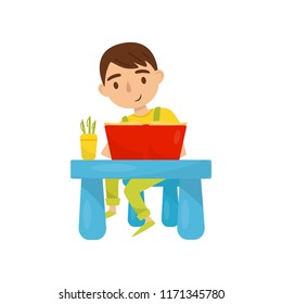 Cute boy sitting at the table and reading a book, kids activity, daily routine vector Illustration on a white background