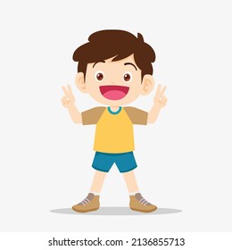 cute boy smile and showing victory sign gesture.Little boy showing victory sign with two fingers. boy showing victory gesture