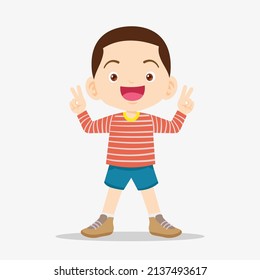 cute boy smile and showing victory sign gesture.Little boy showing victory sign with two fingers. boy showing victory gesture