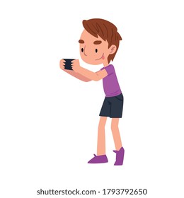 Cute Boy Taking Photo with Camera, Adorable Kid Playing with Favorite Toy Cartoon Vector Illustration on White Background