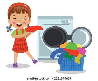 cute boy throwing dirty laundry into the washing machine