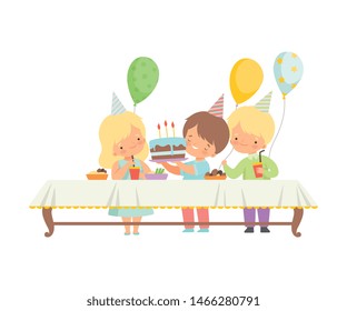 Cute Boys and Girls Celebrating Birthday Party, Kids Sitting at Festive Table with Sweets and Cake Vector Illustration