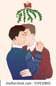 cute boys kissing under the mistletoe on christmas