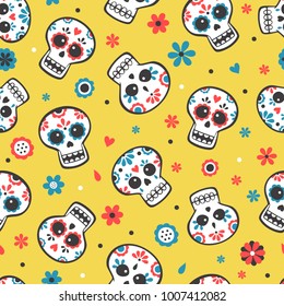 Cute bright vector seamless pattern with skulls and flowers on yellow