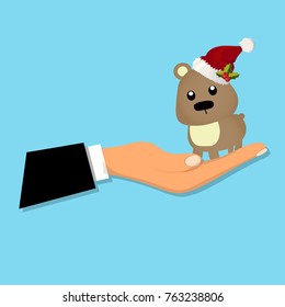 Cute brown bear sitting on a male hand. Cute bear toy or animal presenting. Happy new year illustration