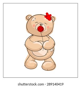 Cute brown teddy bear with a red flower