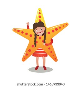 Cute brunette girl in red dress and in sea star costume