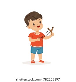 Cute bully boy with a slingshot, hoodlum cheerful little kid, bad child behavior vector Illustration