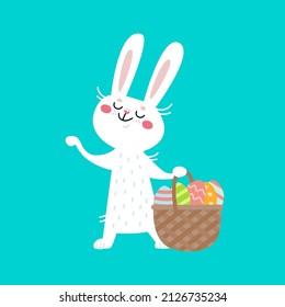 Cute bunny with basket full of Easter eggs. Happy white rabbit with colorful decorated eggs,  holiday spring time. Funny hare, cartoon animal. Hand drawn vector illustration, flat design on blue.  