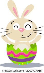 Cute bunny coming out of a broken easter egg