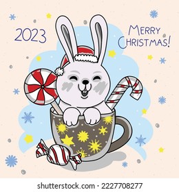 Cute bunny in a cup with sweets, preparation for Merry Christmas, decorations for a card