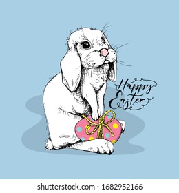 Cute Bunny with a egg. Funny Cartoon Character. Happy Easter - lettering quote. Holiday card, hand drawn style print. Vector illustration.