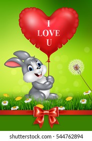 Cute bunny holding red heart balloons on green grass