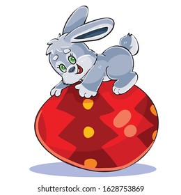 cute bunny lies on a big beautiful Easter egg painted red,