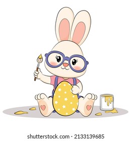 Cute Bunny painting an easter egg.