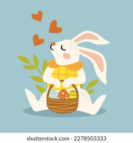 cute bunny sitting with a basket of easter eggs