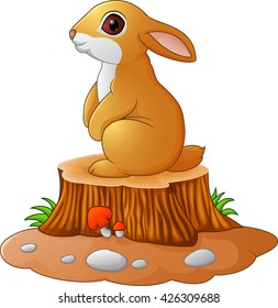 Cute bunny standing on tree stump