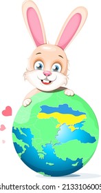 A cute bunny stands behind a globe with a map where Ukraine is
