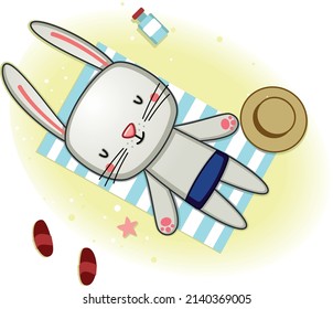 cute bunny sunbathing on the beach