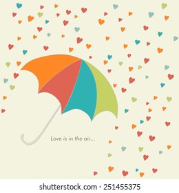 cute card with umbrella and falling hearts