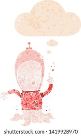 cute cartoon alien with thought bubble in grunge distressed retro textured style