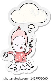 cute cartoon alien with thought bubble as a distressed worn sticker