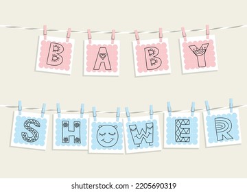 Cute cartoon baby shower cards hanging on a rope with clothes pins. 