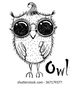 Cute cartoon black and white owl in sunglasses with a phone