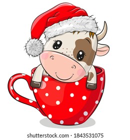 Cute Cartoon Bull in a Santa hat is sitting in a Cup