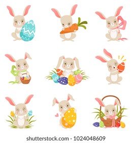 Cute cartoon bunnies holding colored eggs set, funny rabbit characters, Happy Easter concept cartoon vector Illustrations
