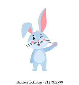 Cute cartoon bunny or rabbit. The hare smiles and waves his hand. Printing on children's T-shirts, greeting cards, posters. Hand-drawn vector stock illustration isolated on a white background