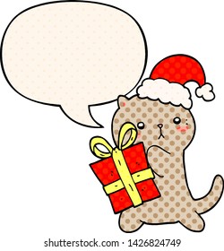 cute cartoon cat carrying christmas present with speech bubble in comic book style