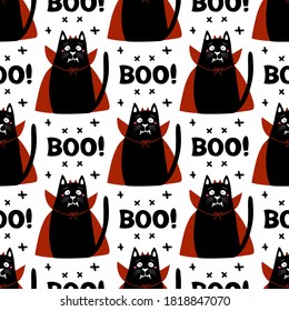 Cute cartoon cat wear vampire costume with fangs, horns and red cloak. Doodle cross elements and boo word. Halloween seamless pattern. Isolated on a white background. Vector stock illustration.