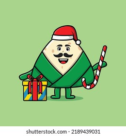 cute cartoon chinese rice dumpling santa clause character is bringing candy cane and boxes christmas