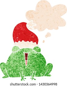 cute cartoon christmas frog with thought bubble in grunge distressed retro textured style