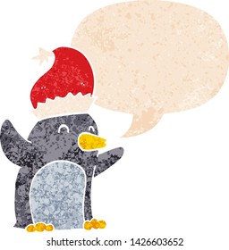 cute cartoon christmas penguin with speech bubble in grunge distressed retro textured style