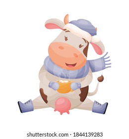 Cute cartoon cow character holding a mug with cocoa and marshmallows. Chinese New year of the zodiac ox cow. Vector illustration.