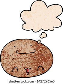 cute cartoon donut with thought bubble in grunge texture style