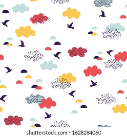 Cute cartoon flying birds and clouds. Geometric natural seamless pattern in scandinavian minimal style. Colorful trendy vector artwork for textile, fabric, wallpaper design